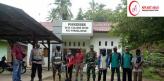 Babinsa Mengkawal Penyemprotan Disinfektan Serentak Sekecamatan Purbolinggo